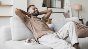 man relaxing in apartment