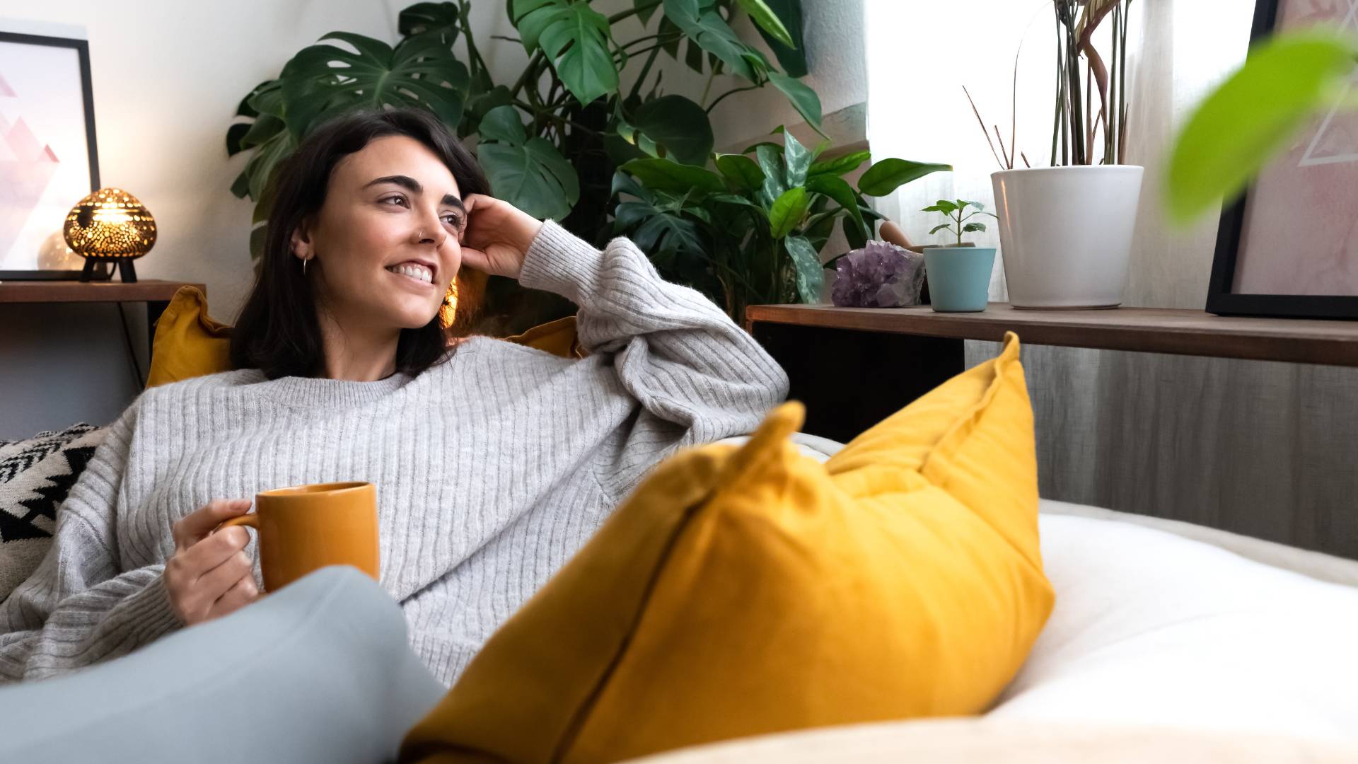 woman drinking tea in apartment